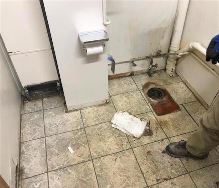 water damaged tile in bathroom