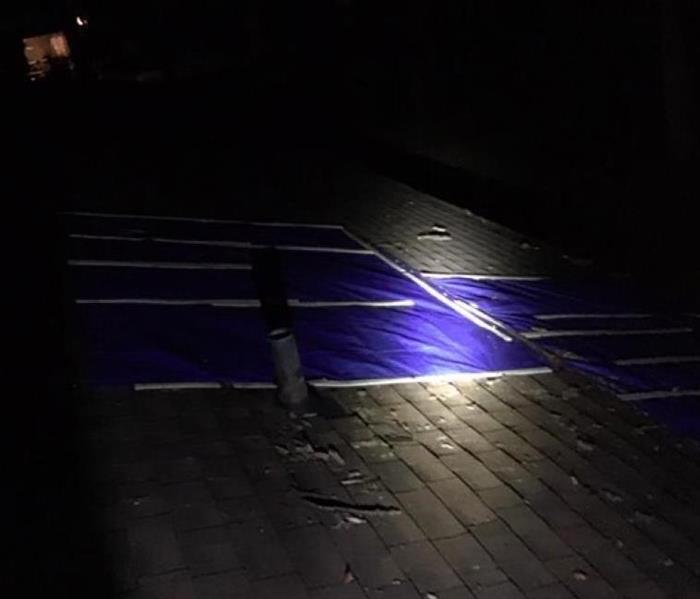 blue tarp on roof 