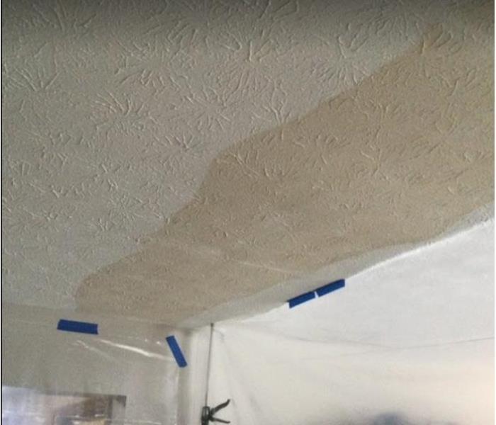 brown water stains on white ceiling