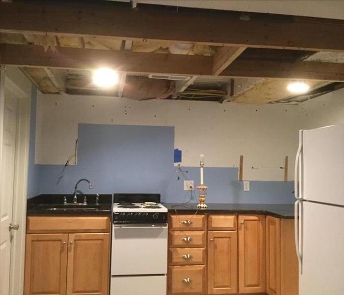 cabinets and ceiling removed from basement kitchen