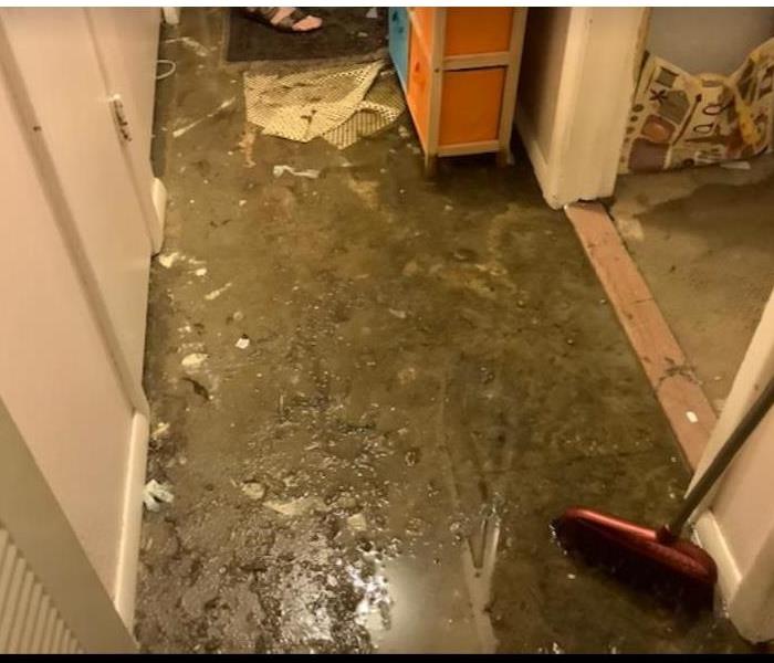 water covering ground in hallway