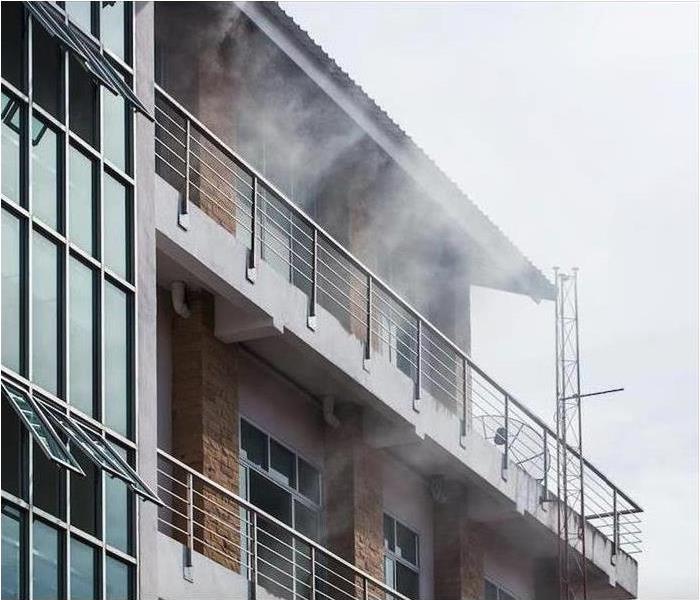 building with smoke coming out 
