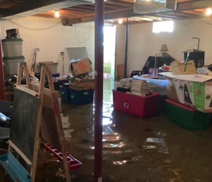 flooded basement with personal items in it