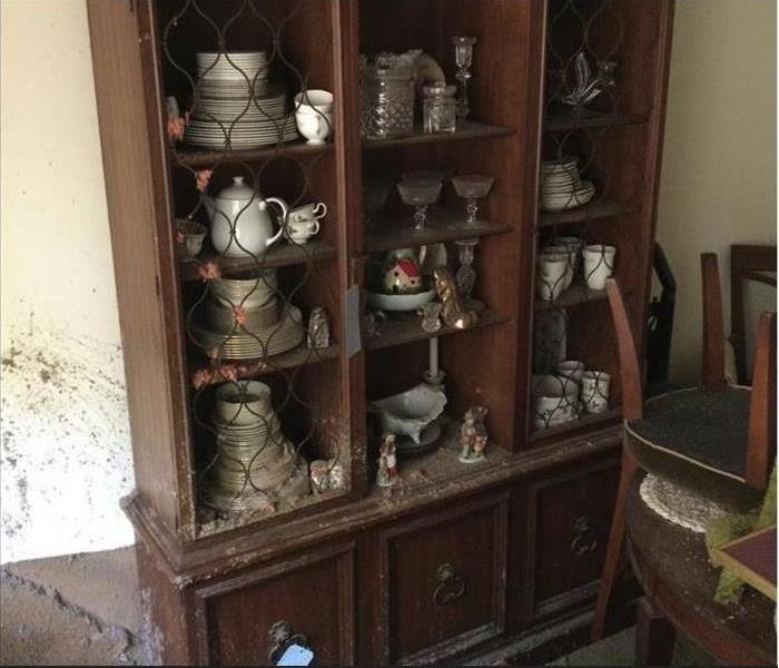 fire damaged cabinet of personal items